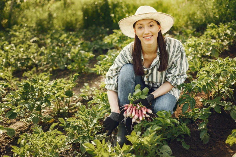 a woman kneeling in a field holding radishes, avatar image