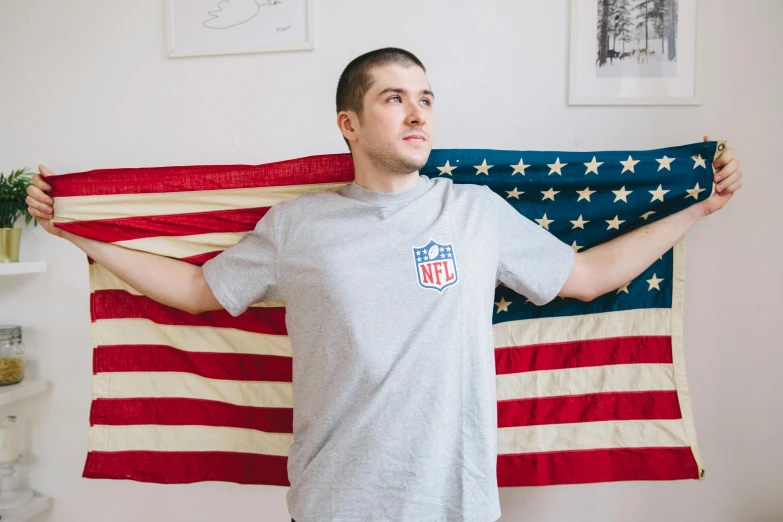 a man standing in front of an american flag, a portrait, featured on reddit, superbowl, full product shot, ilya ozornin, official product photo