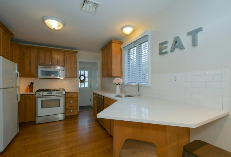 the kitchen is clean and ready for us to use, a portrait, real estate photography, michael pangrazio, counter, eating