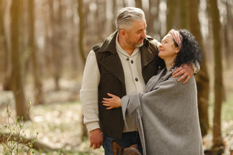 a man standing next to a woman wrapped in a blanket, pexels contest winner, renaissance, enjoying a stroll in the forest, older male, thumbnail, lovely couple