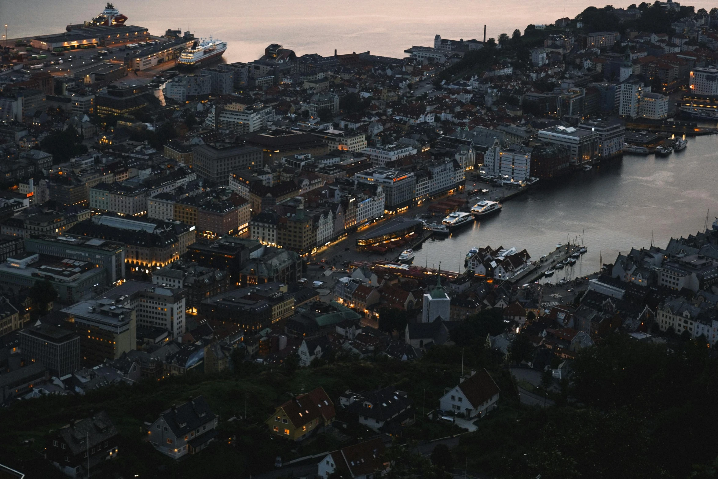 an aerial view of a city at dusk, a photo, by Jesper Knudsen, pexels contest winner, hurufiyya, harbor, grey, thumbnail, brown