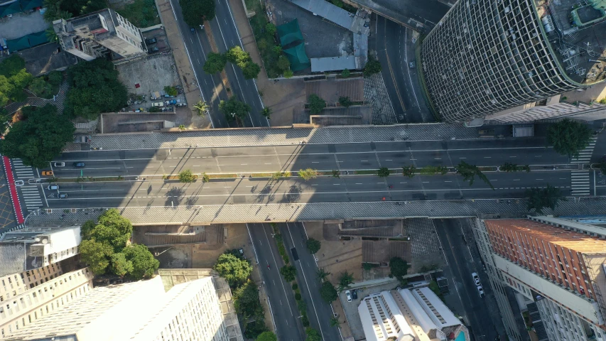 an aerial view of a busy city street, by Alejandro Obregón, pexels contest winner, photorealism, overpass, sao paulo, empty streetscapes, puerto rico