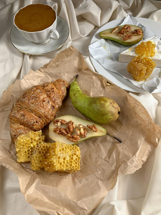 a table topped with plates of food next to a cup of coffee, pear, 5 k, square, cornucopia