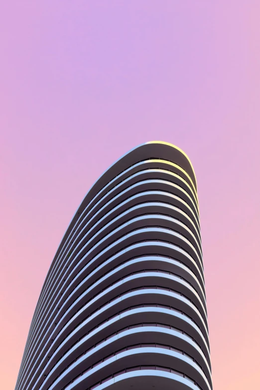 a tall building with a pink sky in the background, inspired by Zaha Hadid, minimalism, rounded face, archviz, miami beach, toronto