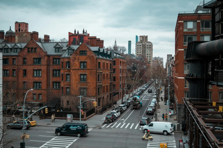 a street filled with lots of traffic next to tall buildings, inspired by Thomas Struth, pexels contest winner, harlem renaissance, neighborhood outside window, chimneys on buildings, college, a quaint