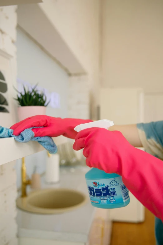 a woman in pink gloves is cleaning a shelf, pexels, blue and white and red mist, youtube thumbnail, mr clean, home