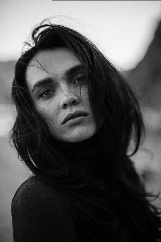 a black and white photo of a woman with long hair, inspired by Peter Lindbergh, angular eyebrows, sydney hanson, young jennifer connelly, kai carpenter