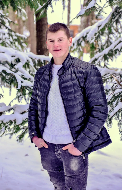 a man standing in the snow next to a tree, profile image, model wears a puffer jacket, high school, uploaded