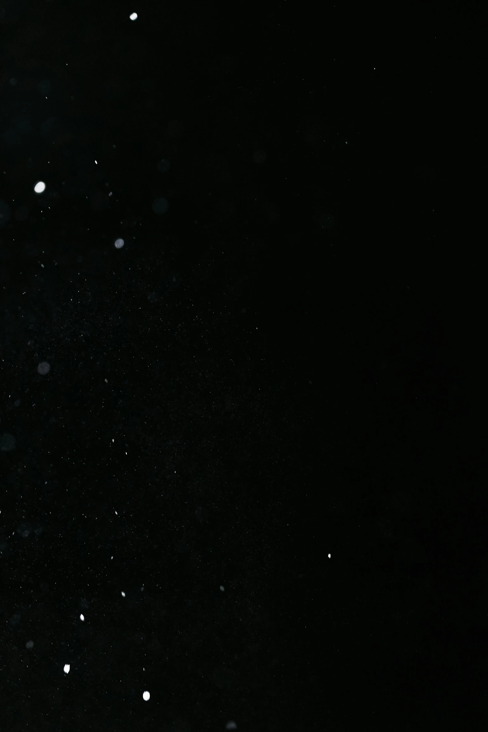 a man flying through the air while riding a snowboard, by Cornelis Verbeeck, unsplash, hurufiyya, webcam screenshot, white with black spots, raining! nighttime, desolate :: long shot