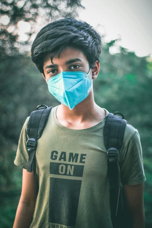 a young man wearing a blue face mask, trending on pexels, green shirt, 🚿🗝📝, assamese aesthetic, discord profile picture