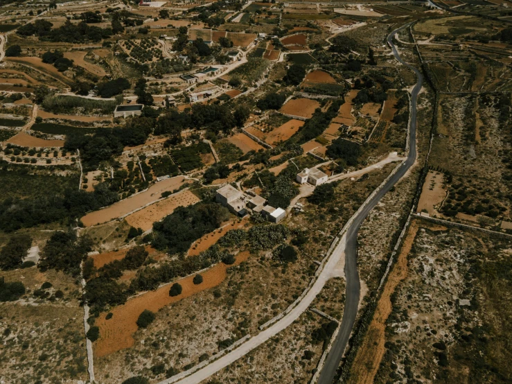 an aerial view of a small town in the middle of the desert, pexels contest winner, cyprus, lush valley, sanjulian. detailed texture, farm