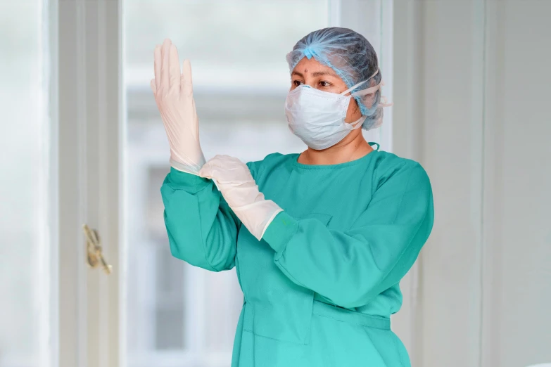 a woman wearing a surgical mask and gloves, shutterstock, hurufiyya, greeting hand on head, med bay, screensaver, high contreast