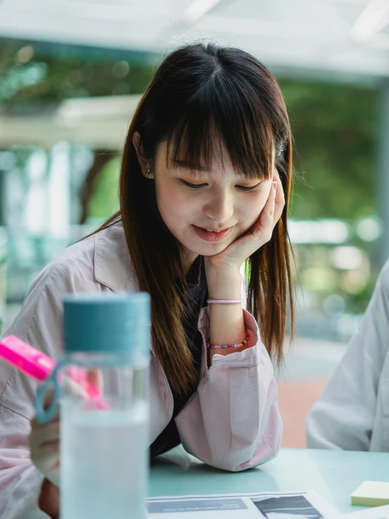 a couple of people that are sitting at a table, by Tan Ting-pho, pexels contest winner, academic art, teenage female schoolgirl, confident looking, ethnicity : japanese, bashful expression