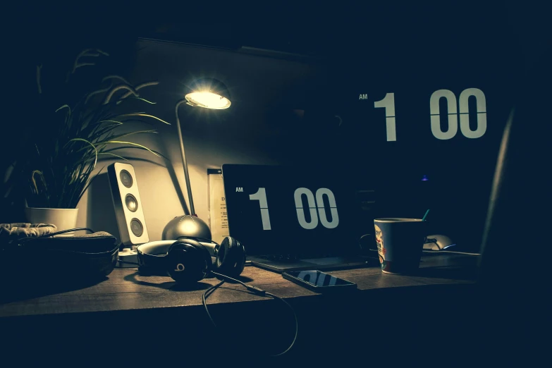 a laptop computer sitting on top of a wooden desk, inspired by Elsa Bleda, unsplash, analytical art, clocks, dark bedroom, nightime, thumbnail