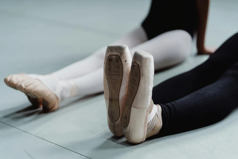 a pair of ballet shoes sitting on the floor, by Elizabeth Polunin, pexels contest winner, arabesque, panoramic shot, sweat, thumbnail, close together
