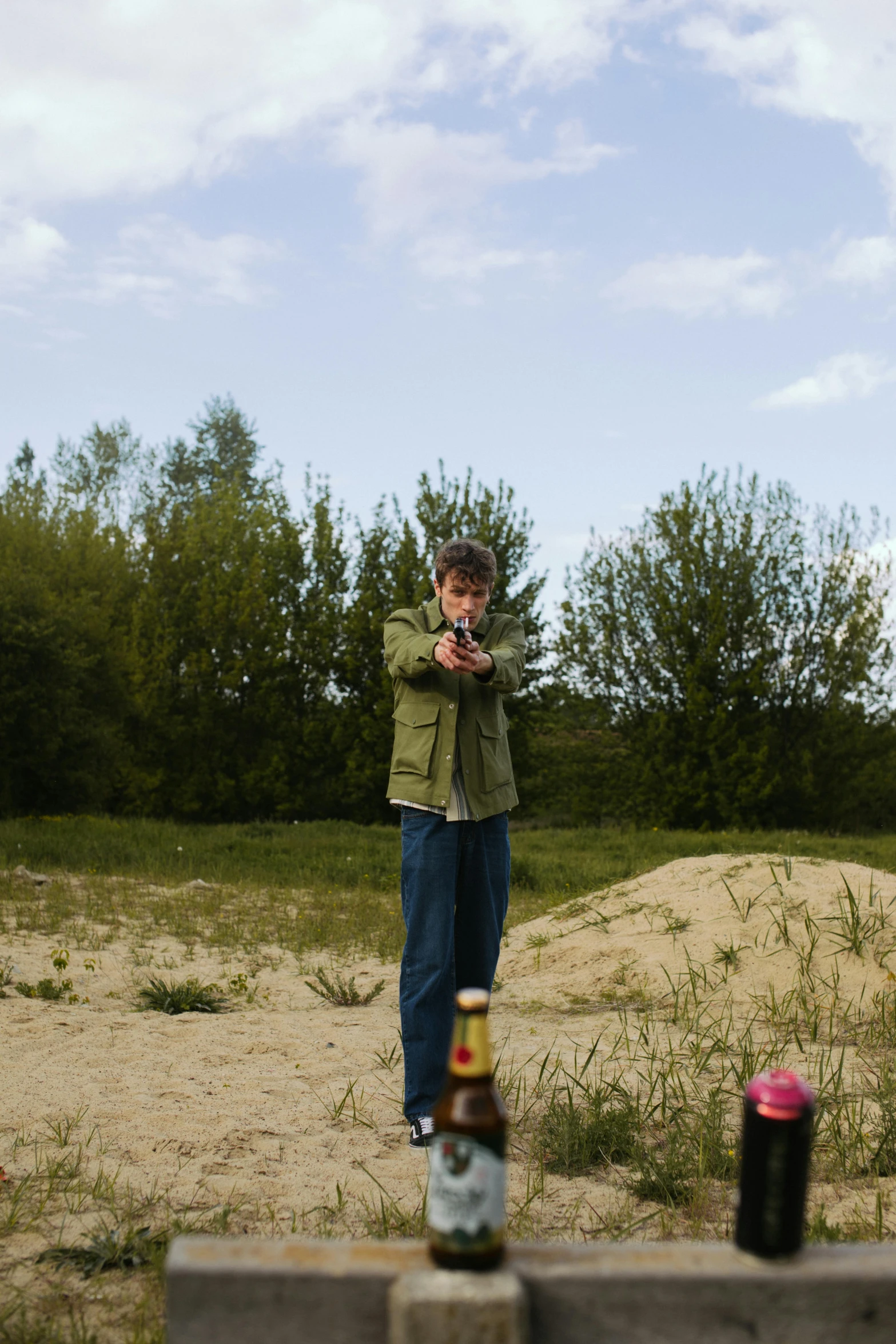 a man taking a picture of himself with his cell phone, an album cover, by Attila Meszlenyi, land art, holding beer bottles, teenage boy, 2010s, battle action shot