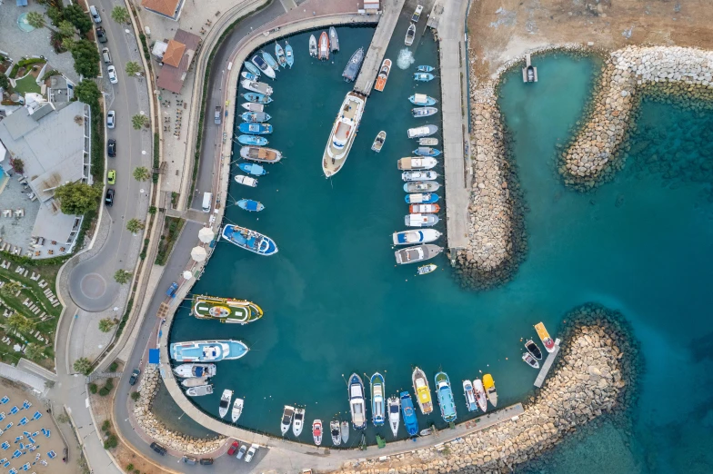 a large body of water filled with lots of boats, by Tom Wänerstrand, pexels contest winner, hurufiyya, cyprus, flatlay, harbour, conde nast traveler photo