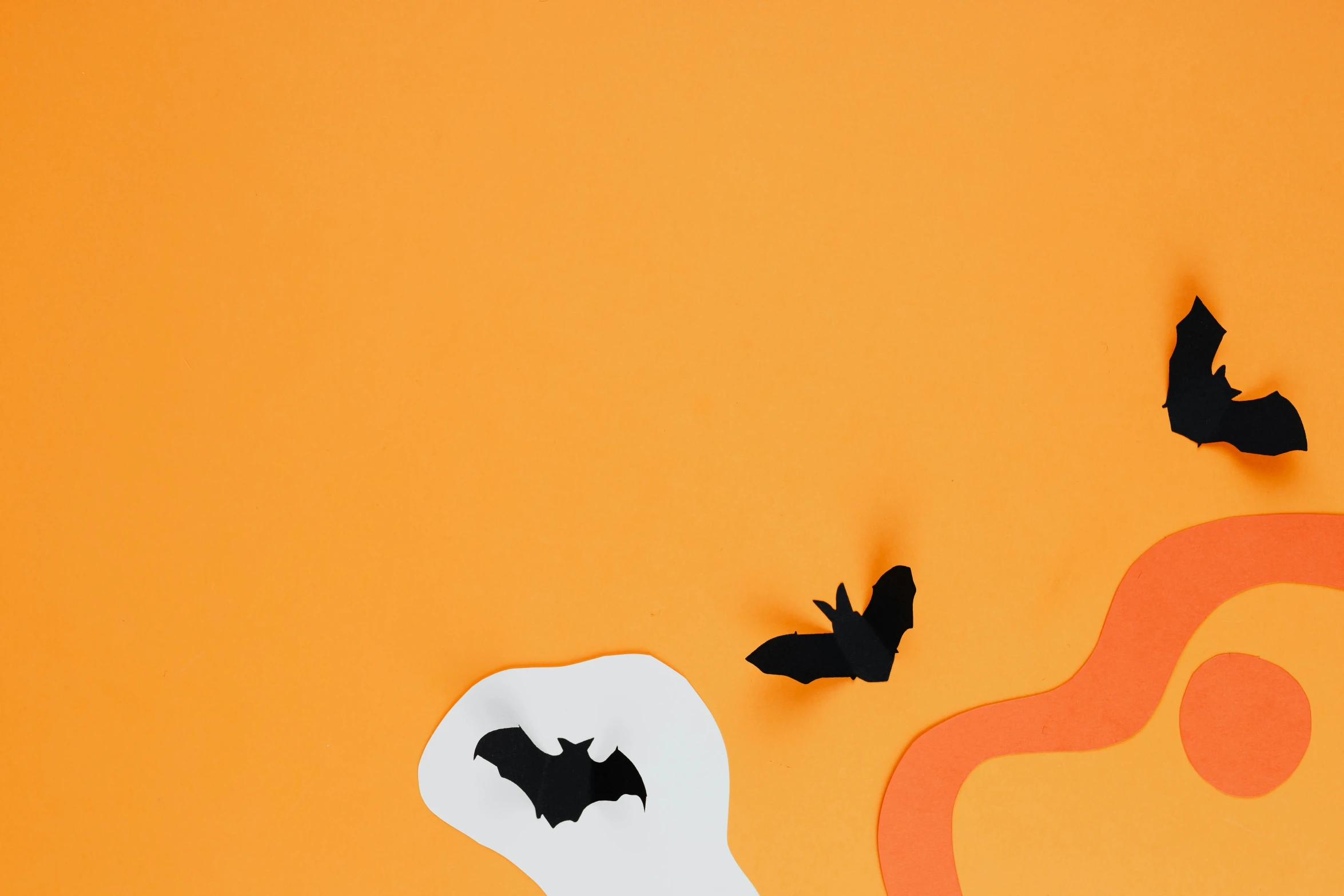 a paper cutout of a ghost and bats on an orange background, trending on pexels, conceptual art, background image, instagram picture, liquid glue spots, detailed product image