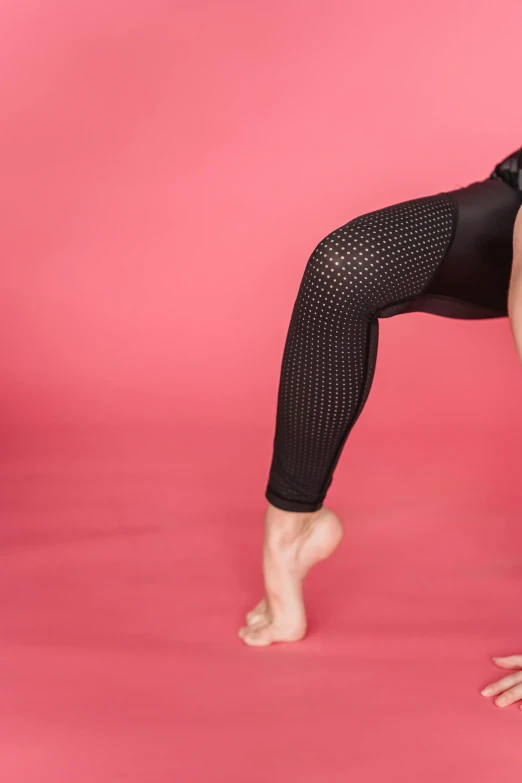 a woman in a black leo leo leo leo leo leo leo leo leo leo leo leo leo, trending on pexels, arabesque, fishnet tights, solid background, bent over posture, pink