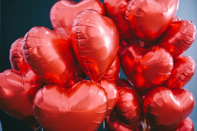 a bunch of red heart shaped balloons, by Julia Pishtar, pexels contest winner, metallic, thumbnail, gloss, lightweight