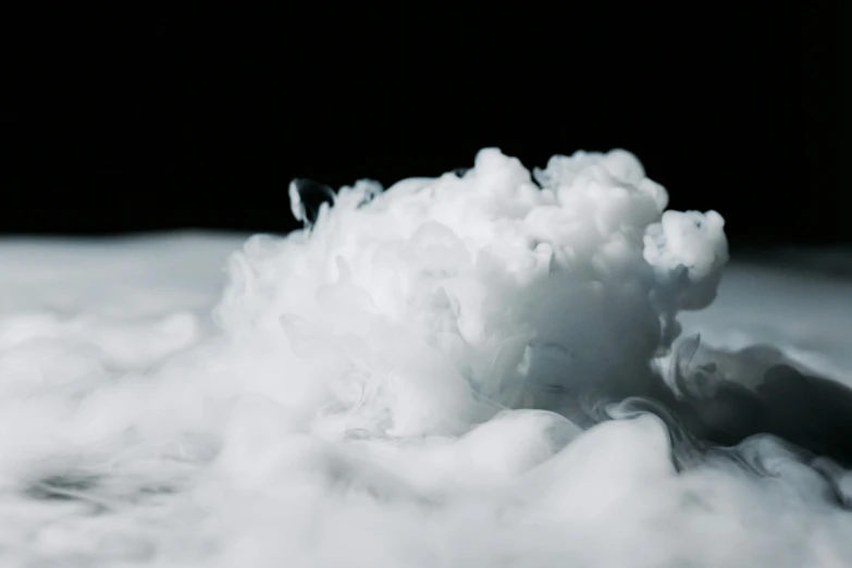 a pile of snow sitting on top of a snow covered ground, a macro photograph, unsplash, process art, liquid smoke, cumulus, close-up product photo, flowing milk