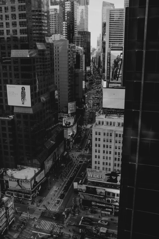 a black and white photo of a city, inspired by Thomas Struth, pexels contest winner, time square, street top view, ads, view