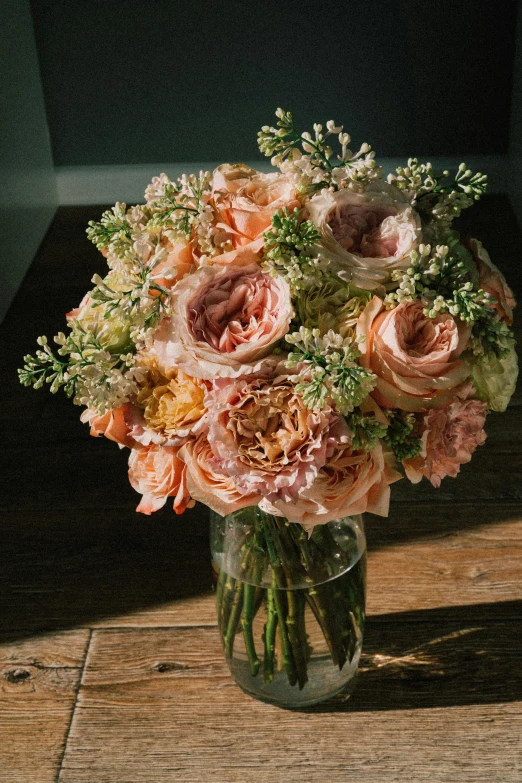 a vase filled with flowers sitting on top of a wooden table, a pastel, award-winning crisp details”, crown of peach roses, ethereal soft and fuzzy glow, full sun
