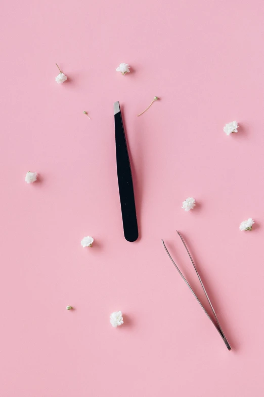 a pair of scissors sitting on top of a pink surface, a cartoon, trending on pexels, magic realism, seeds, long nails, cake, carnation