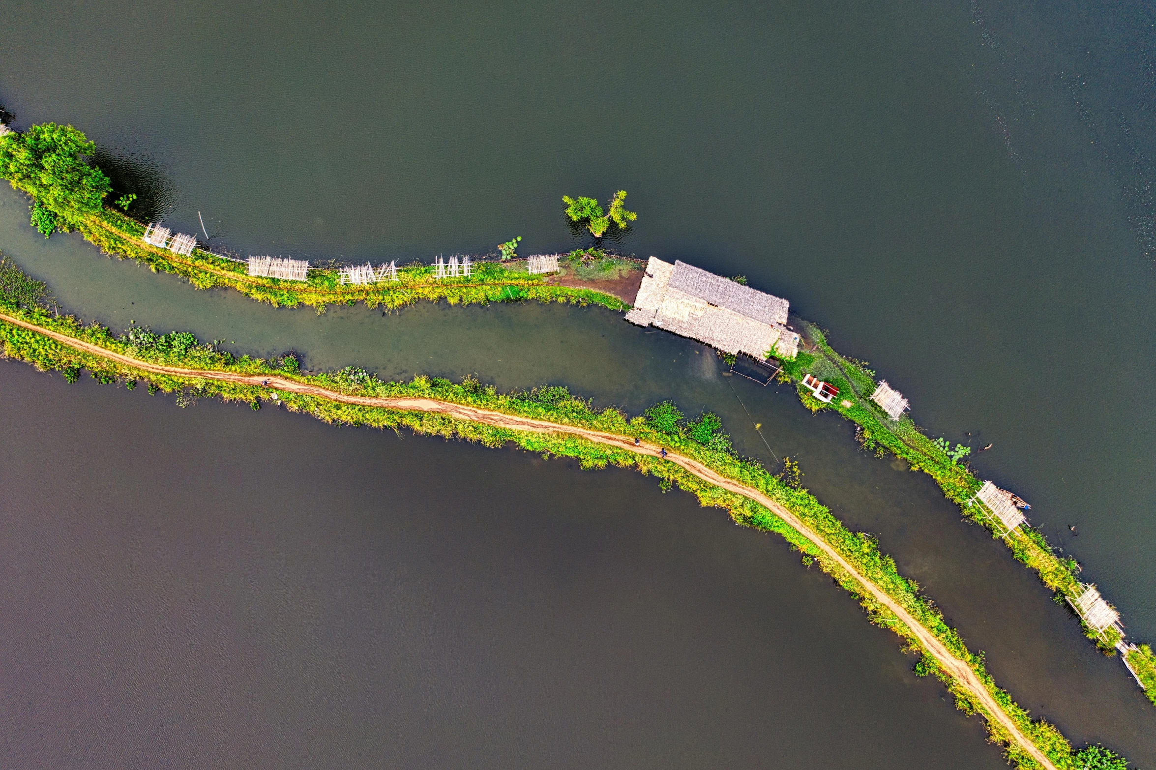 an aerial view of a large body of water, by Daniel Lieske, pexels contest winner, hurufiyya, building along a river, hoang long ly, sustainability, near a jetty