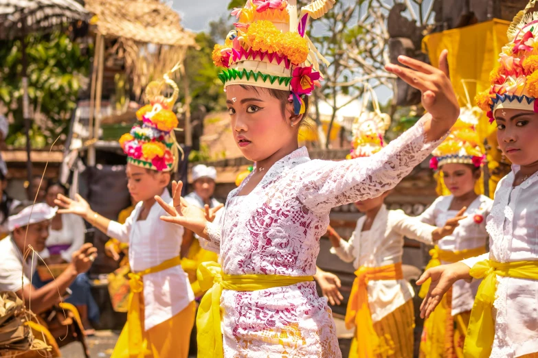 a group of people that are standing in the street, a portrait, pexels contest winner, happening, intricate gold headdress, girl dancing on cliff, barong family, square