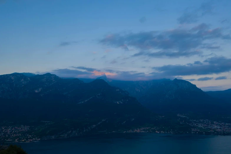 a large body of water surrounded by mountains, by Tobias Stimmer, pexels contest winner, romanticism, late evening, blue, alpes, subtle detailing