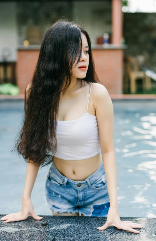 a beautiful young woman standing next to a swimming pool, by Tan Ting-pho, trending on pexels, renaissance, wearing a cropped top, asian girl with long hair, 15081959 21121991 01012000 4k, wearing a camisole