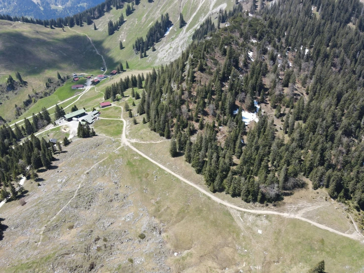 an aerial view of a ski resort in the mountains, les nabis, solo hiking in mountains trees, head straight down, black fir, discovered photo