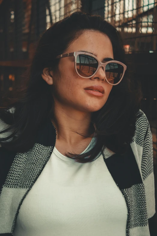 a close up of a person wearing sunglasses, a picture, rosalia, wearing casual clothing, promo image, grainy photo