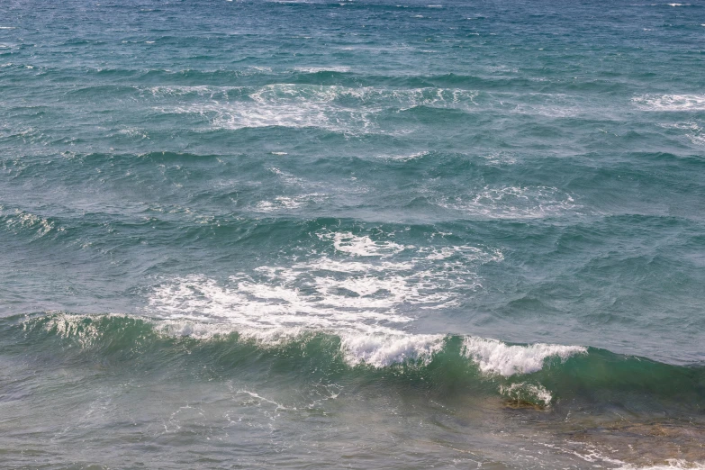 a man riding a wave on top of a surfboard, an album cover, by Alison Watt, unsplash, renaissance, ocean sprites, glistening seafoam, mediterranean, photograph of april