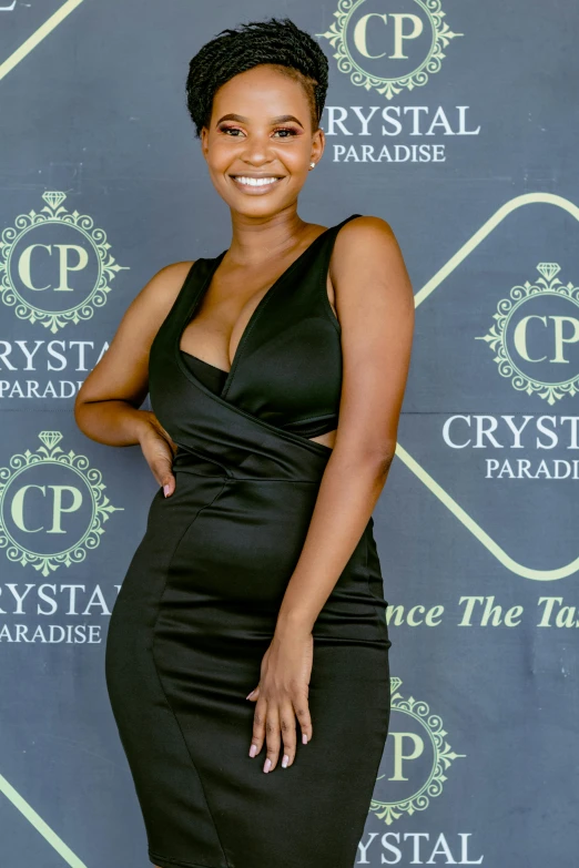 a woman in a black dress posing for a picture, crystall, promotional image, paradise, uncropped