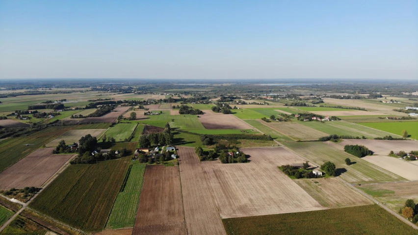 an aerial view of a farm in the country, by Hans Beat Wieland, pexels contest winner, panorama distant view, 15081959 21121991 01012000 4k, ultra high quality, viewed from bellow
