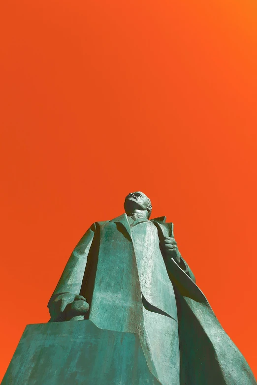 a statue of a man standing in front of an orange sky, unsplash, socialist realism, he wears a big coat, green bright red, alvar aalto, martin luther king