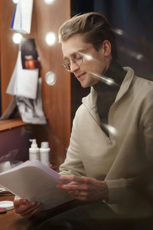 a woman reading a piece of paper in front of a mirror, by Robert Medley, trending on reddit, man wearing a closed cowl, reading glasses, melanchonic soft light, recital
