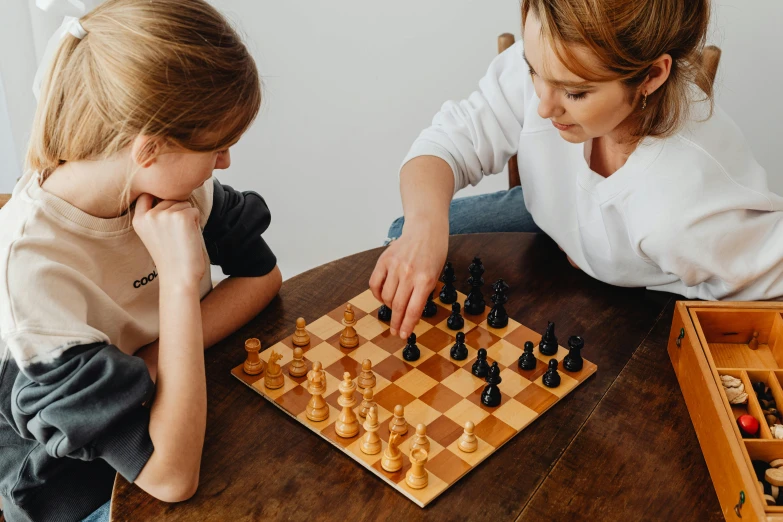 a couple of kids playing a game of chess, a portrait, unsplash contest winner, 15081959 21121991 01012000 4k, manuka, 40 years old women, profile image