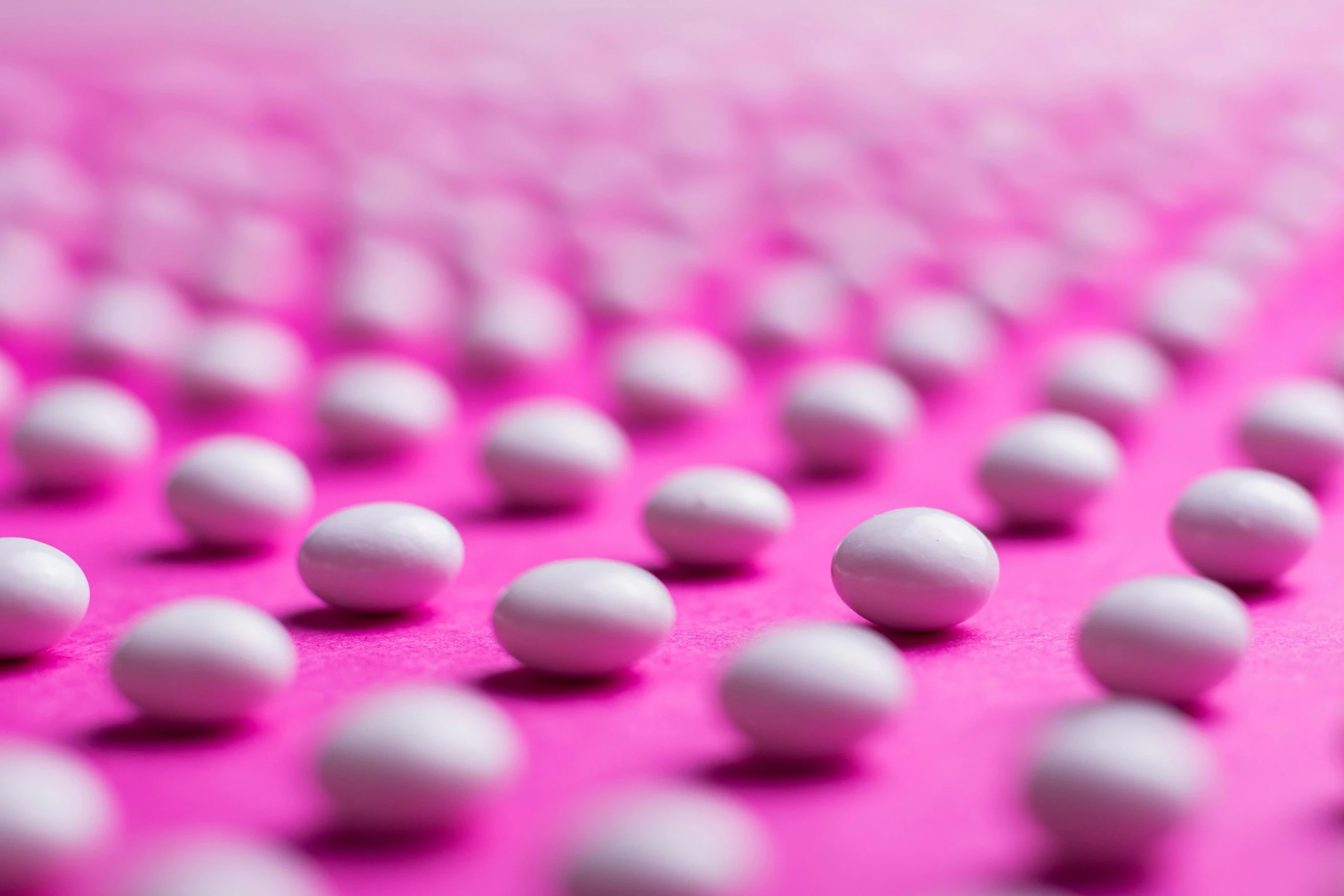 a bunch of white balls sitting on top of a pink surface, contracept, getty images, 15081959 21121991 01012000 4k, elliot alderson