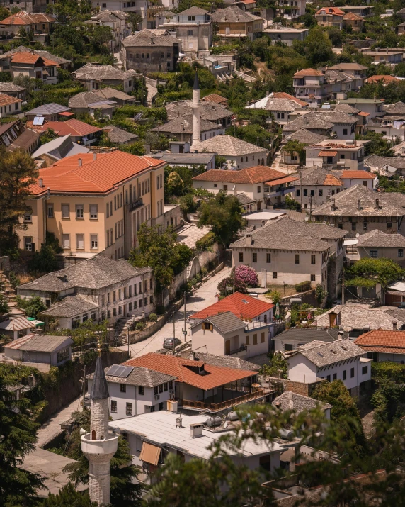 a view of a town from the top of a hill, whitewashed buildings, lush surroundings, tiled roofs, unsplash photo contest winner