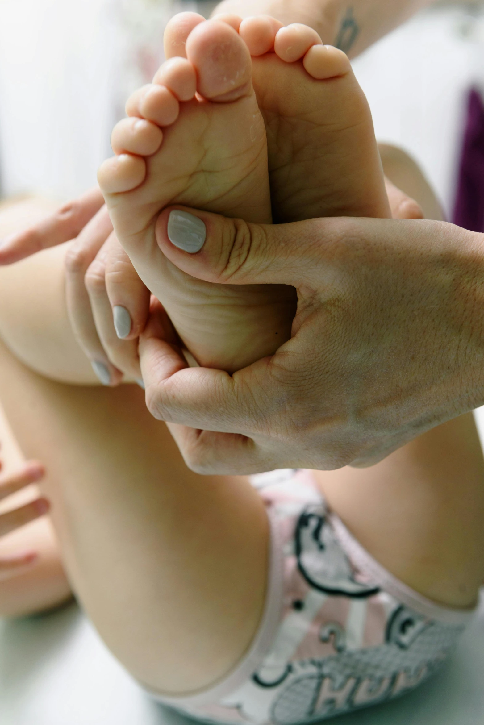 a close up of a person getting a foot massage, toddler, uploaded, detailing, petite