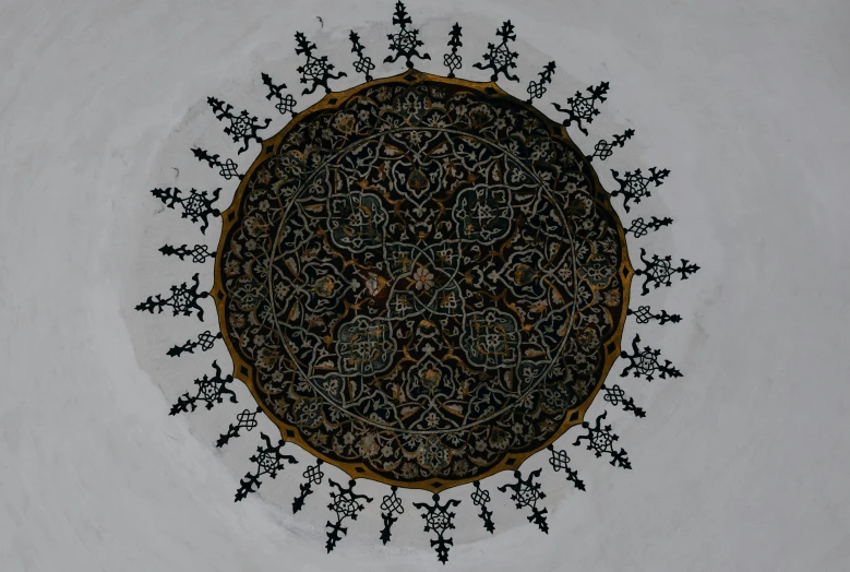 a circular design on the ceiling of a building, a detailed painting, by Abdullah Gërguri, pexels contest winner, arabesque, on a gray background, embroidery, medieval art style, brown