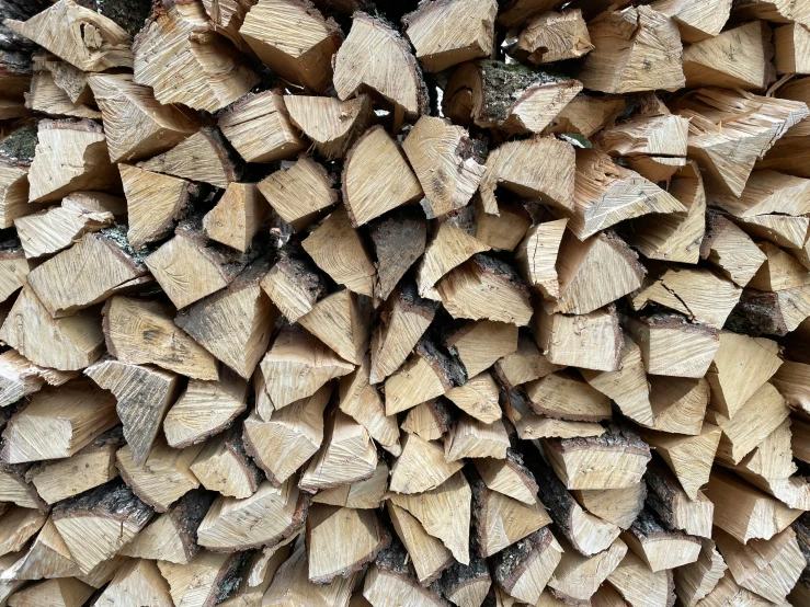 a pile of wood stacked on top of each other, by Jaakko Mattila, unsplash, highly detailed image, woodfired, 2000s photo, 10k