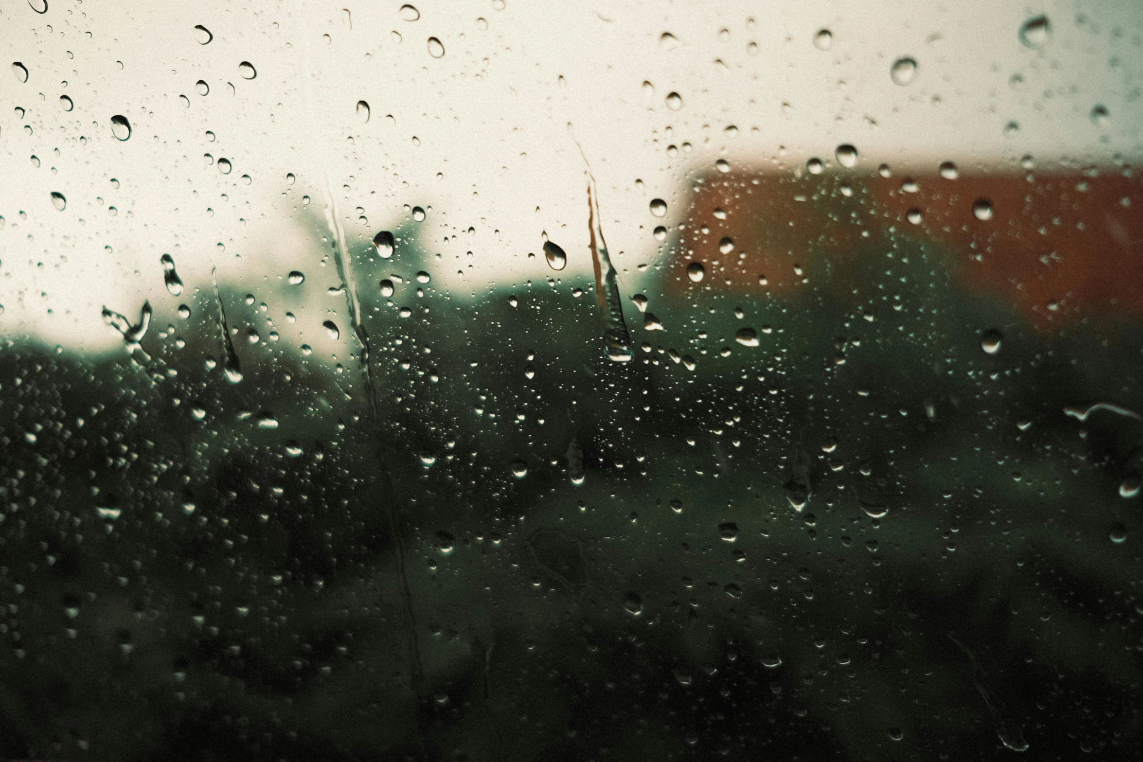 a close up of a window with raindrops on it, a picture, inspired by Elsa Bleda, unsplash, tonalism, green rain, alessio albi, rainy day. nintendo64, chillhop