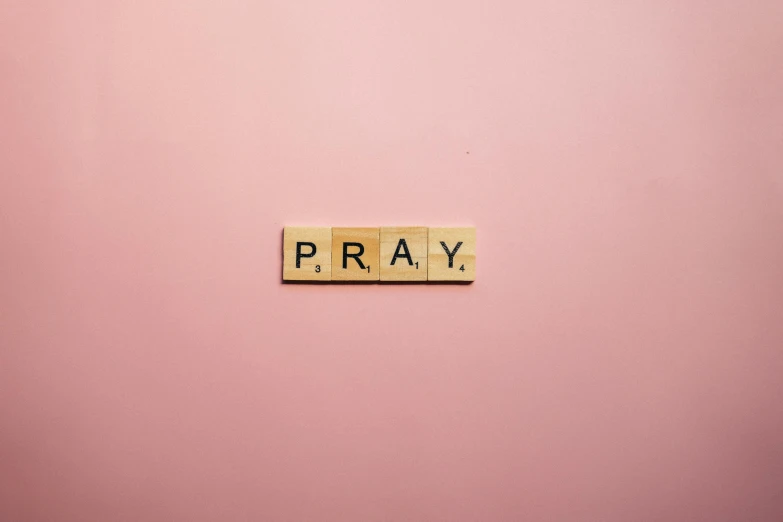 the word pray spelled with scrabbles on a pink background, by Carey Morris, pexels, 1 6 x 1 6, emergency, flat, a wooden