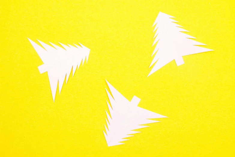 a group of paper airplanes flying through the air, a screenprint, inspired by Patrick Caulfield, pexels, christmas tree, white and yellow scheme, high angle close up shot, 3 - piece