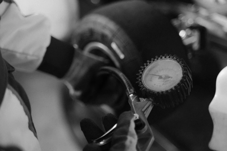 a close up of a person working on a motorcycle, by David Simpson, jaquet droz, teaser, turbo, profile image