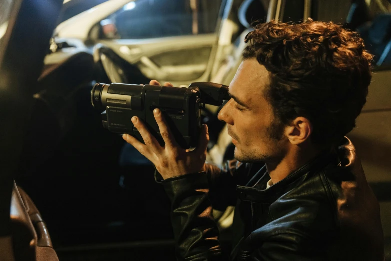 a man taking a picture of a car with a camera, robert sheehan, cyber noir, print ready, full color still